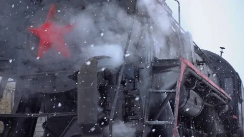 Gimbal slow motion epic old steam locomotive train Blizzard winter snowfall film Stock Footage 155668313