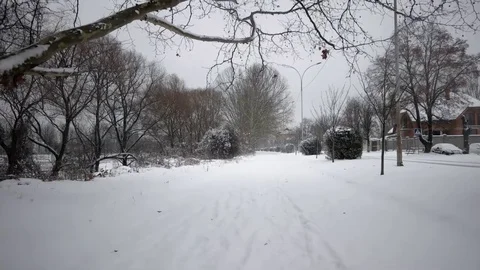Gimbal Stabilized Pov Shot of Someone Walking by Snow-Covered Alley, Avenue on Stock Footage