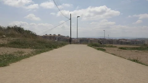Gimbal suburbs path trail stabilized Terrassa traveling concrete summer- Stock Footage 113608049