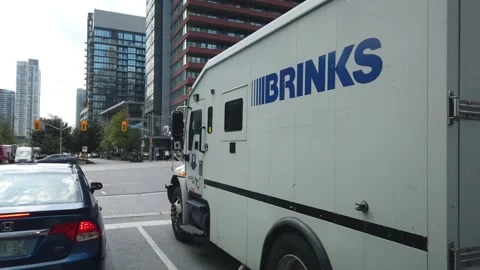 Gimbal Timelapse Driving Next to Brinks Secure Cash Management Truck Stock Footage 147451960