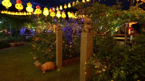 Gimbal view night garden with lantern and lion statue Stock Footage 150311580