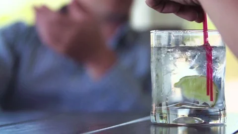 Gin and Tonic Stirred - Close Up Outdoor Porch Cocktail Stock Footage 83395312