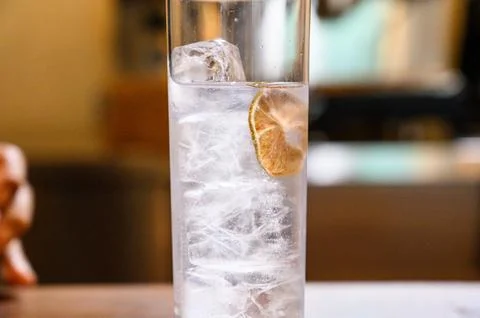 Gin tonic refreshing drink with lime and ice Stock Photos