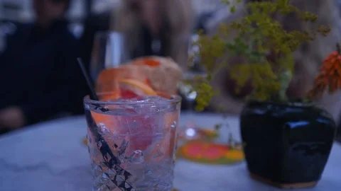 Gin Tonic on Table with Movement in the Background Stock Footage 91290027