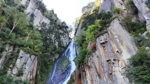 Ginga Waterfall | Low Angle | Blue Sky | Cliff | Early Autumn | Hokkaido Stock Footage 329050018