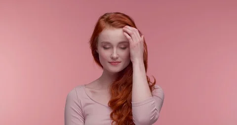 Ginger Attractive Makeup Model posinf at Pink Studio, Beauty Industry. Stock Footage 126218913