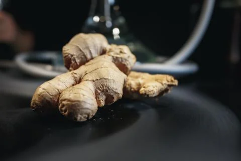 Ginger on black background. In the background are hookah and smoke. Stock Photos