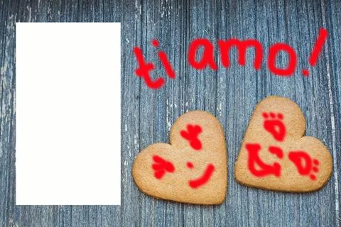 Ginger bread biscuits with fanny faces on grey wooden aged background with semi Stock Photos