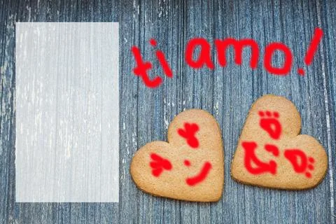 Ginger bread biscuits with fanny faces on grey wooden aged background with semi Stock Photos