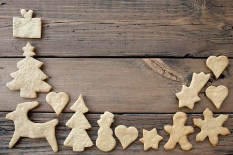 Ginger Breads Building a Frame on Wood, Background with Copy Space Stock Photos