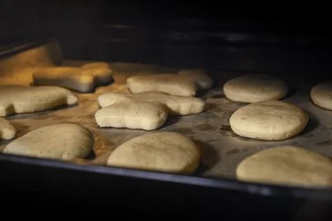 Ginger cookies in the oven, the process of making cookies Stock Photos