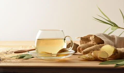 Ginger drink on wooden rustic table white isolated background 스톡 사진