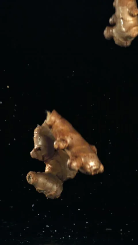 Ginger falls on the table. Filmed on a high-speed camera at 1000 fps Stock Footage 335362951