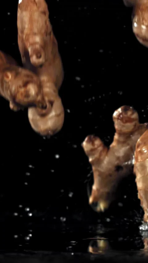 Ginger falls on the table. Filmed on a high-speed camera at 1000 fps Stock Footage 335363489