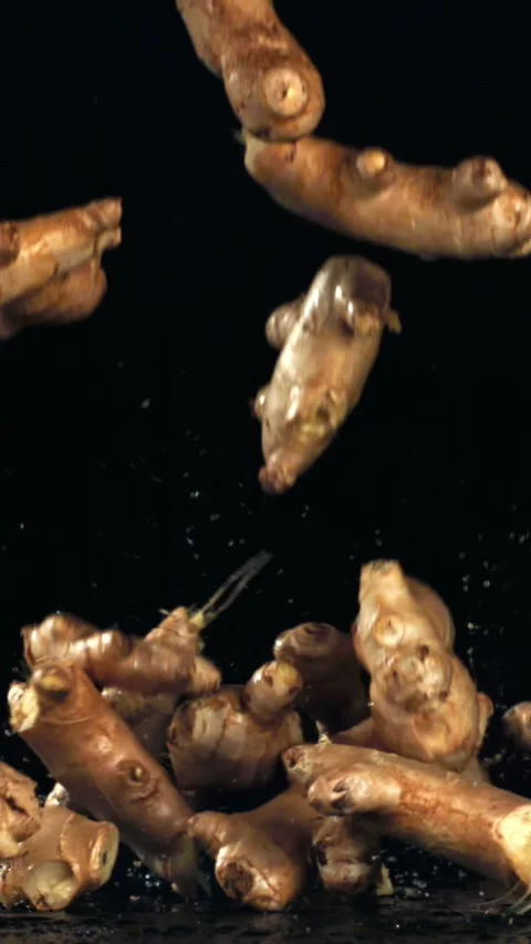 Ginger falls on the table. Filmed on a high-speed camera at 1000 fps Stock Footage 335365320