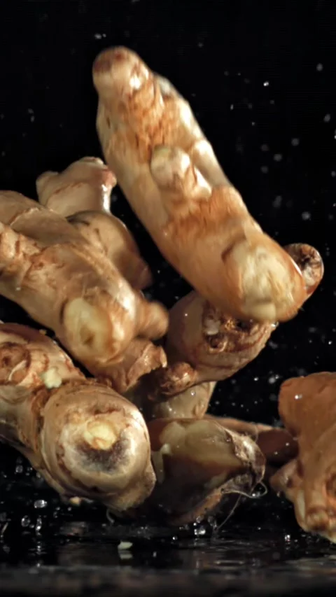 Ginger falls on the table. Filmed on a high-speed camera at 1000 fps Stock Footage 335371676