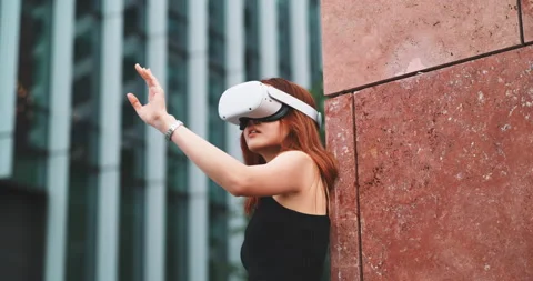 Ginger girl in the city using vr glasses Stock Footage 201686946