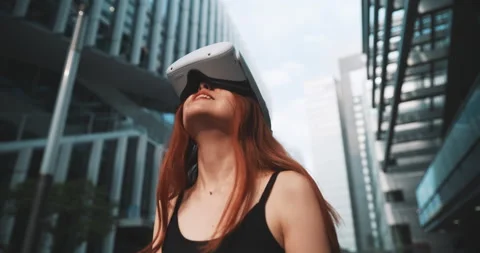 Ginger girl using her new vr glasses in the city Stock Footage 201678158