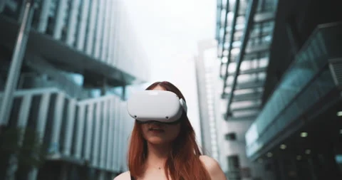 Ginger girl using virtual reality glasses in the city Stock Footage 201678540