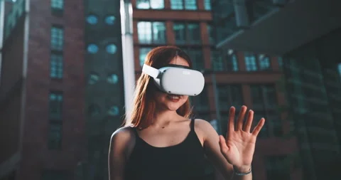 Ginger girl using virtual reality goggles Stock Footage 201679618