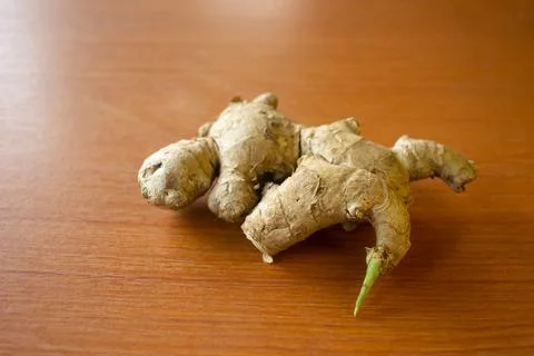 Ginger herbal plant. placed on a brown table Stock Photos