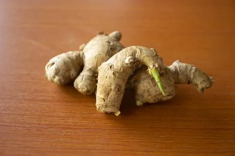 Ginger herbal plant. placed on a brown table Stock Photos