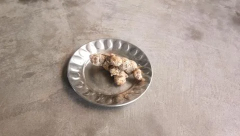 Ginger inside a steel dish Stock Photos