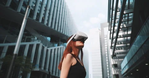 Ginger lady experiencing vr in the business district Stock Footage 201686888