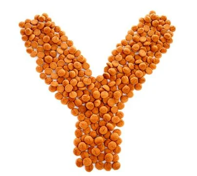 Ginger nuts, pepernoten, in the shape of letter y Stock Photos