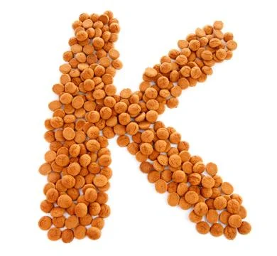 Ginger nuts, pepernoten, in the shape of letter k Foto stock