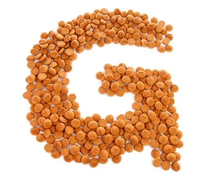 Ginger nuts, pepernoten, in the shape of letter g Stock Photos