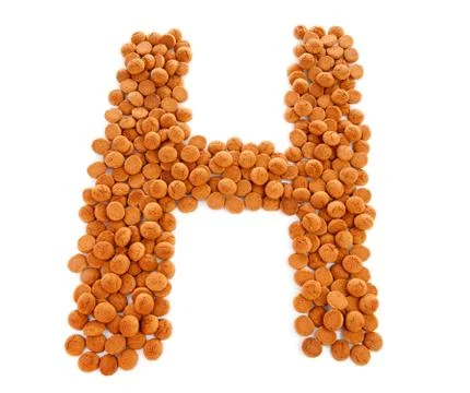 Ginger nuts, pepernoten, in the shape of letter h Stock Photos