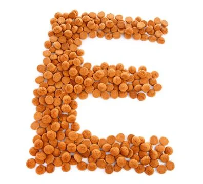 Ginger nuts, pepernoten, in the shape of letter e Stock Photos