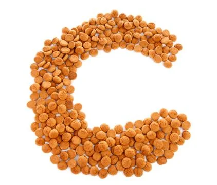 Ginger nuts, pepernoten, in the shape of letter c Stock Photos