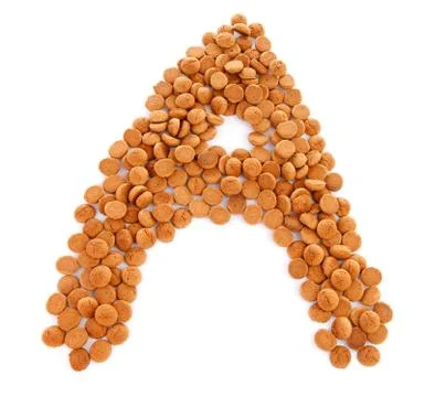 Ginger nuts, pepernoten, in the shape of letter a Stock Photos