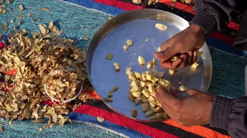 Ginger or adrak known as (Zingiber officinale). Ginger roots peeling with k.. Stock-Footage 227905434