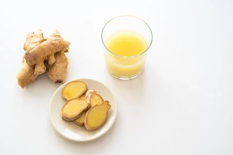 Ginger root and ginger juice. Stock Photos