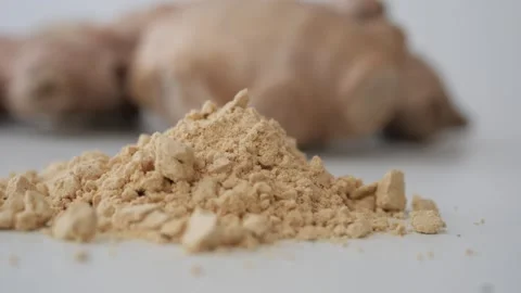 Ginger root and ginger powder on white background close up, natural spice i.. Stock Footage 332116144
