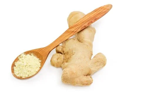 Ginger root and ginger powder in wooden spoon Stock Photos