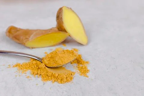 Ginger root and ginger powder top view. Stock Photos
