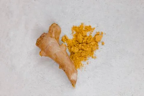 Ginger root and ginger powder flat lay in the shape of heart Stock Photos