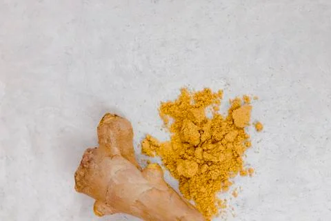 Ginger root and ginger powder flat lay in the shape of heart Stock Photos
