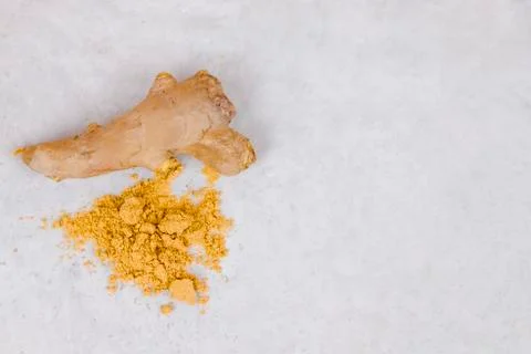Ginger root and ginger powder top view. Stock Photos