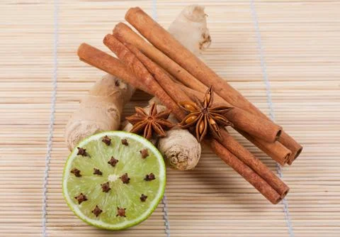 Ginger root, anise, cinnamon, lime and cloves Stock Photos