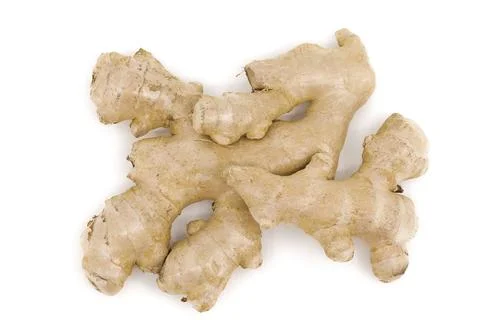 Ginger root presented on a clean white backdrop. Stock Photos
