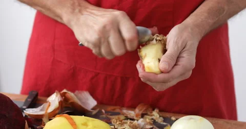 Ginger root scrubbed using teaspoon, close up Stock Footage 147510662