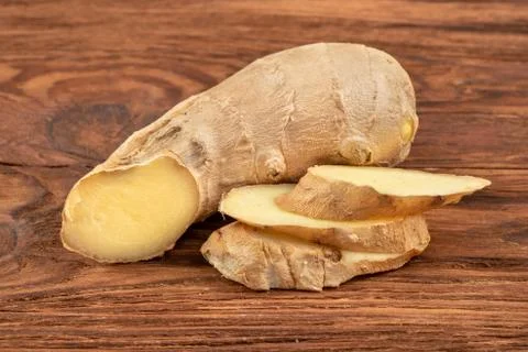 Ginger root with slices Stock Photos