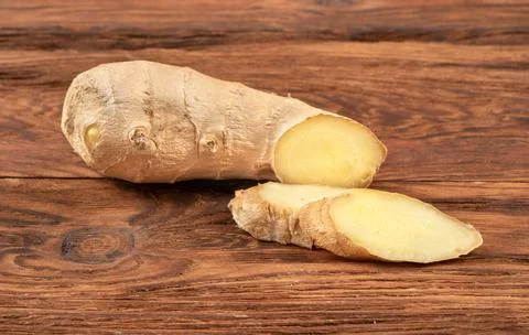 Ginger root with slices Stock Photos