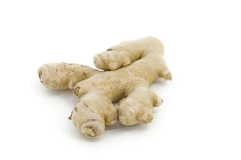 Ginger root on white, displaying its uneven organic form and textured skin .. Stock-Fotos