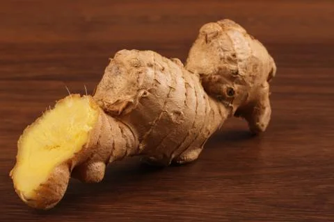 The Ginger root on the wood Stock Photos